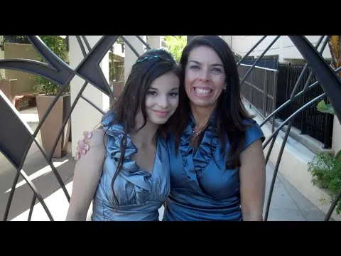 A bat mitzvah girl and her mom smiling together at the Turnip Rose in Costa Mesa.