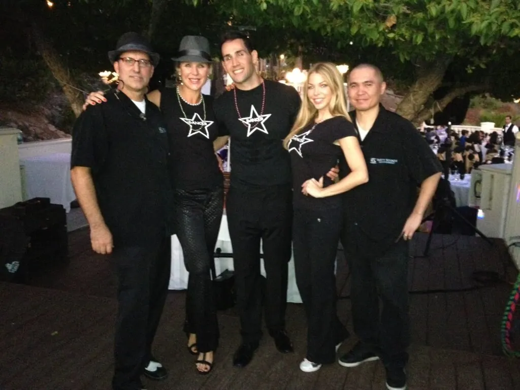 The Tasty Sounds crew in matching black shirts at an outdoor event.