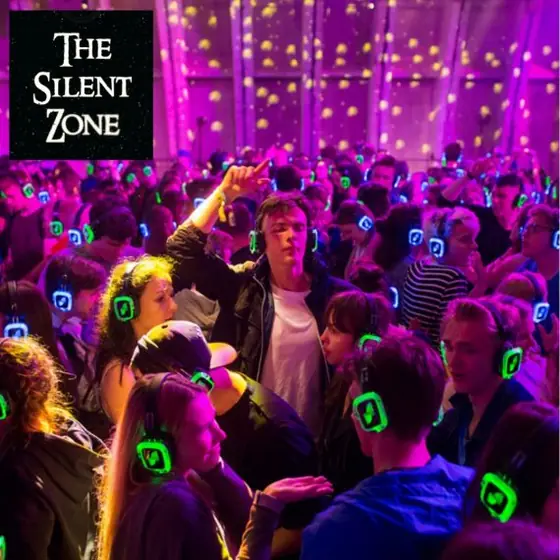 A packed Silent Zone dance floor, every guest in light-up headphones.