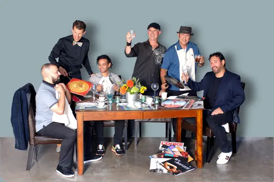 The Tasty Sounds DJs around a dinner table, serving up vinyl records as the meal.